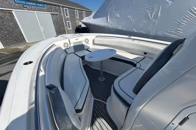 Slide: The Image of 2020 Tidewater 232 LXF boat interior with seating and table at Oyster Harbors Marine. - 17