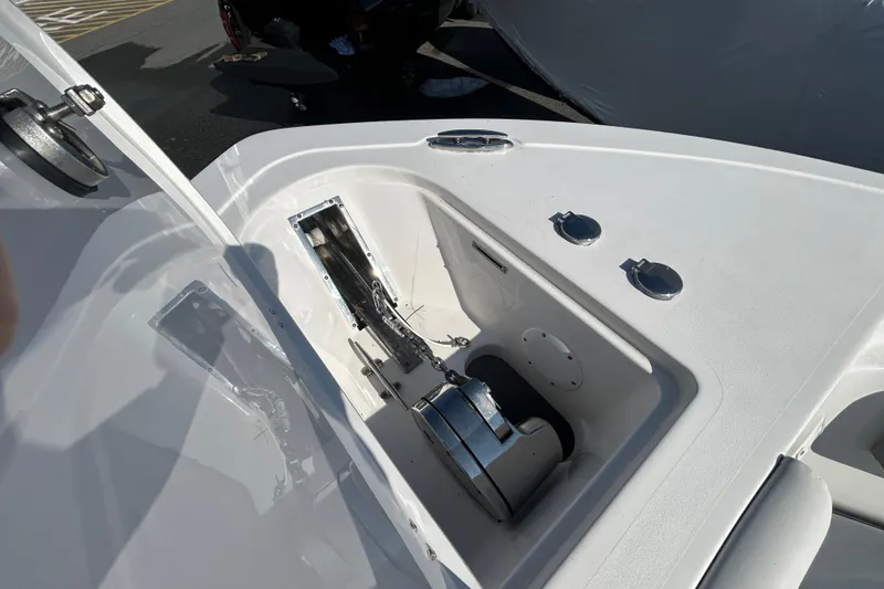 Slide: The Image of 2020 Tidewater 232 LXF boat anchor compartment with stainless steel fittings. - 20