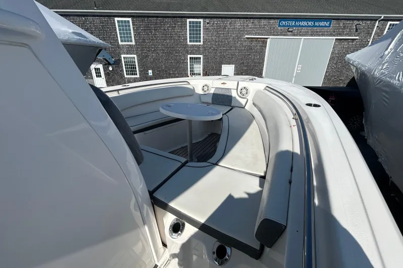 Slide: The Image of 2020 Tidewater 232 LXF boat with spacious seating and table at Oyster Harbors Marine. - 23