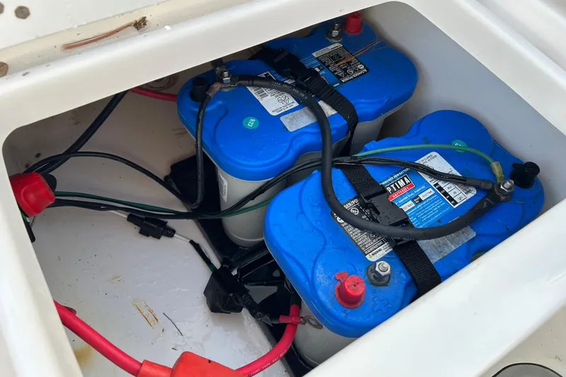 Slide: The Image of Batteries in a 2020 Tidewater 232 LXF boat compartment, featuring Optima BlueTop models. - 25