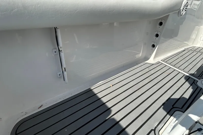 Slide: The Image of Interior view of 2020 Tidewater 232 LXF boat with gray non-slip flooring. - 27