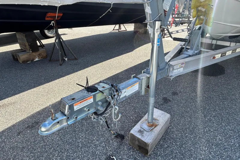 Slide: The Image of Trailer hitch of a 2020 Tidewater 232 LXF boat on asphalt surface. - 29