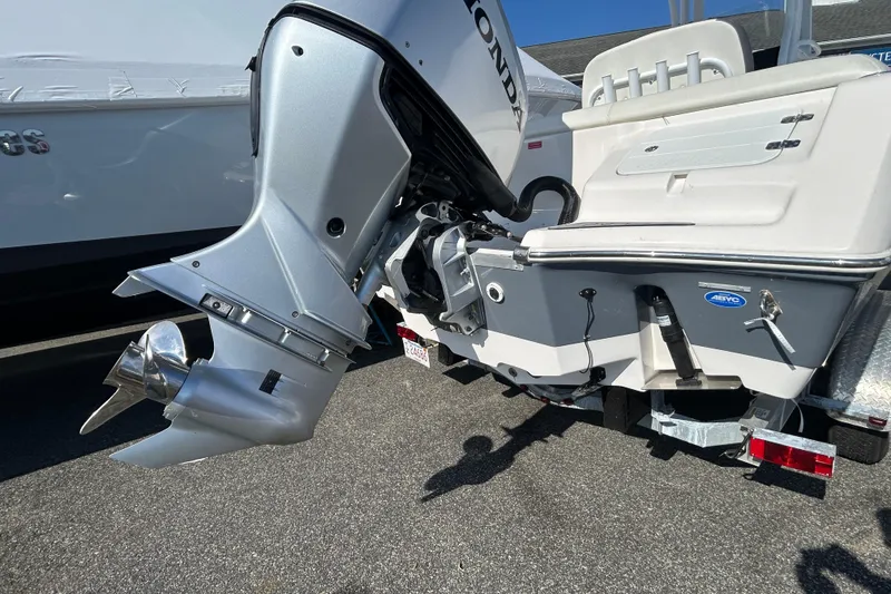 Slide: The Image of 2020 Tidewater 232 LXF boat with Honda outboard motor, rear view. - 31