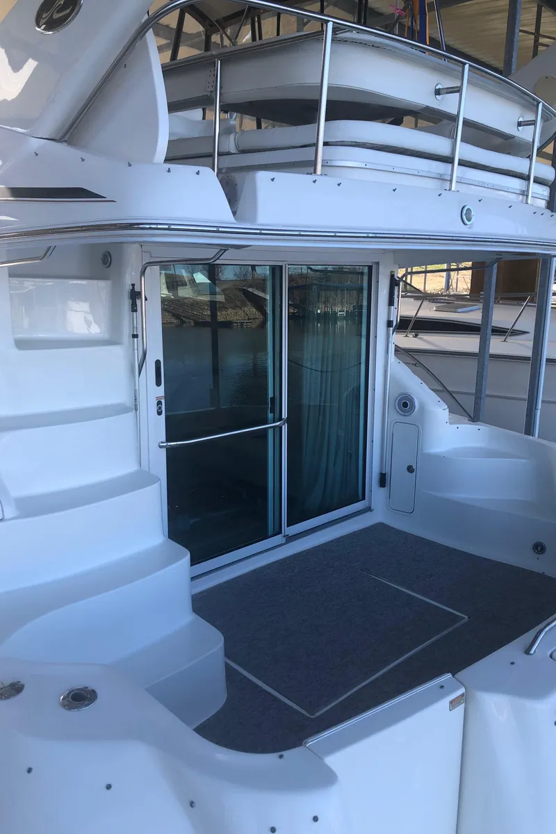 Slide: The Image of 2001 Sea Ray 400 Sedan Bridge yacht with spacious deck and sliding glass doors. - 10