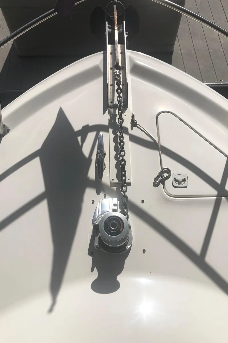 Slide: The Image of 2001 Sea Ray 400 Sedan Bridge bow with anchor chain and winch. - 12