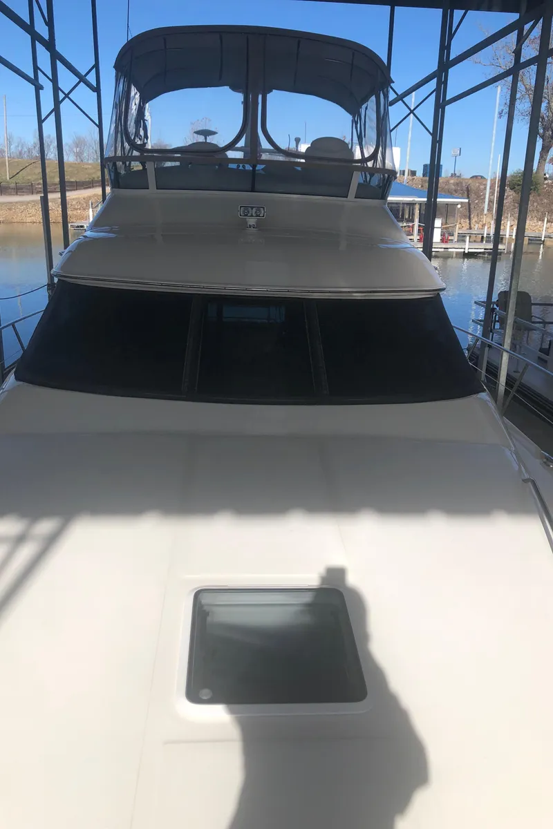 Slide: The Image of 2001 Sea Ray 400 Sedan Bridge yacht docked in marina. - 13