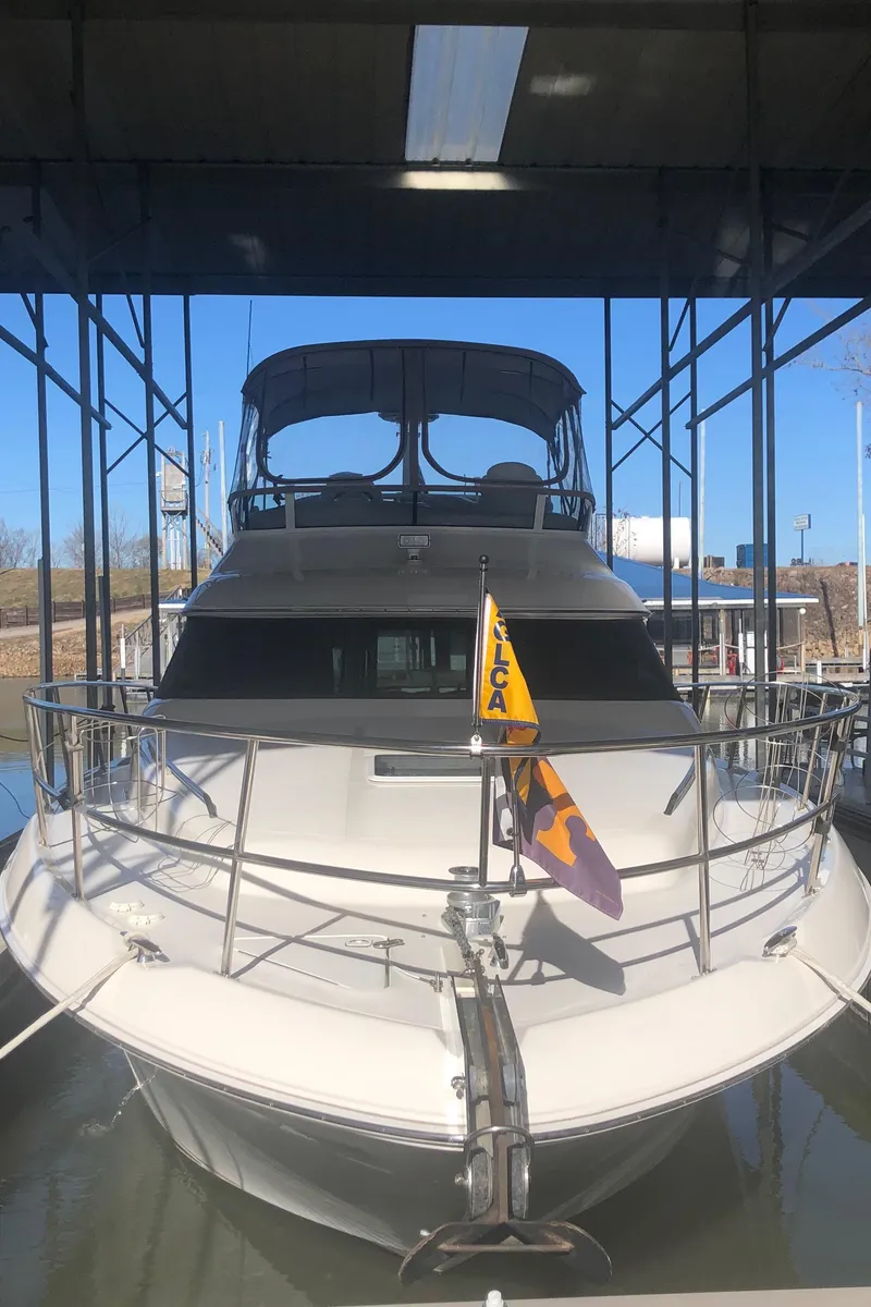 Slide: The Image of 2001 Sea Ray 400 Sedan Bridge yacht docked in marina. - 2