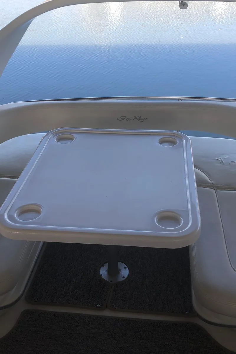 Slide: The Image of 2001 Sea Ray 400 Sedan Bridge table with ocean view. - 20