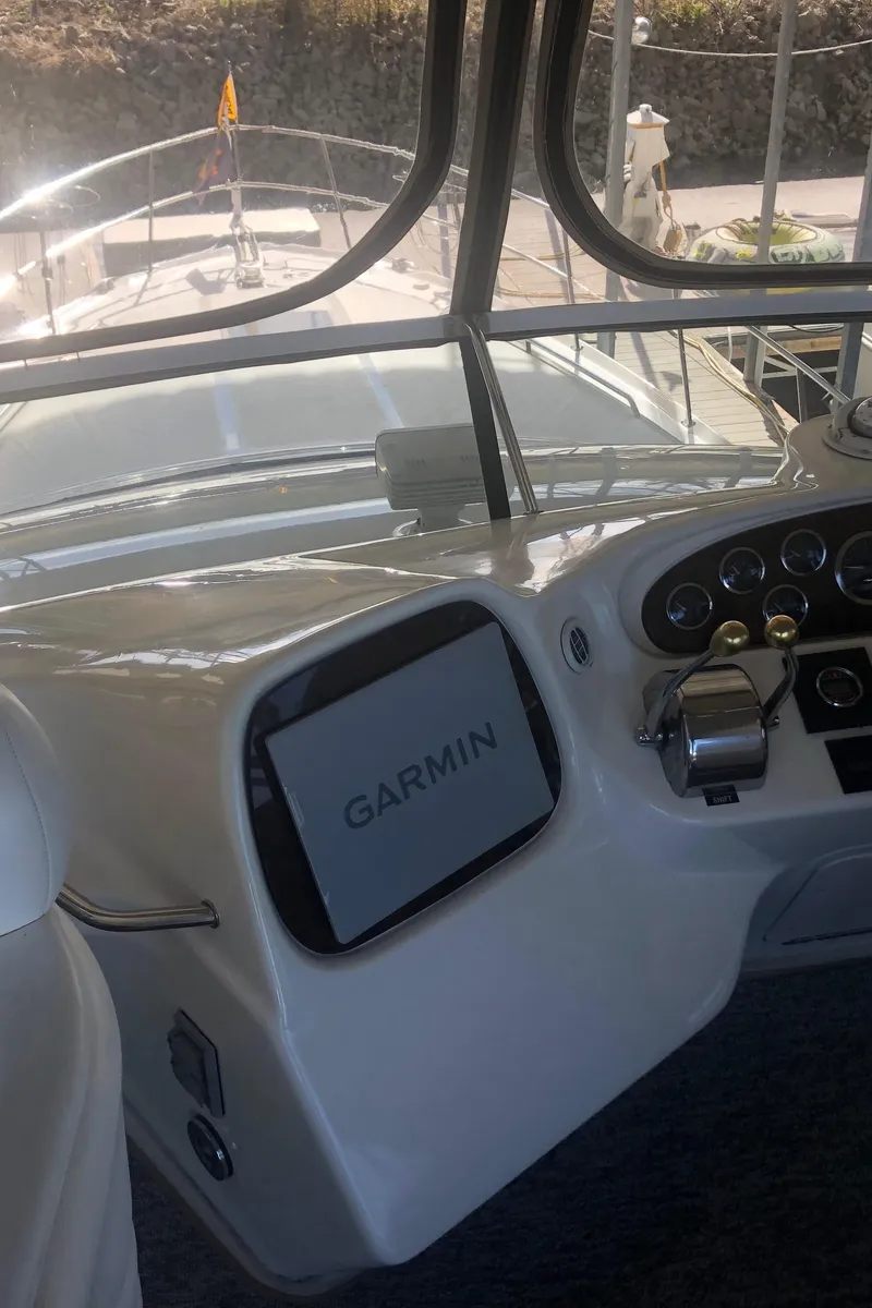 Slide: The Image of 2001 Sea Ray 400 Sedan Bridge helm with Garmin navigation system. - 23