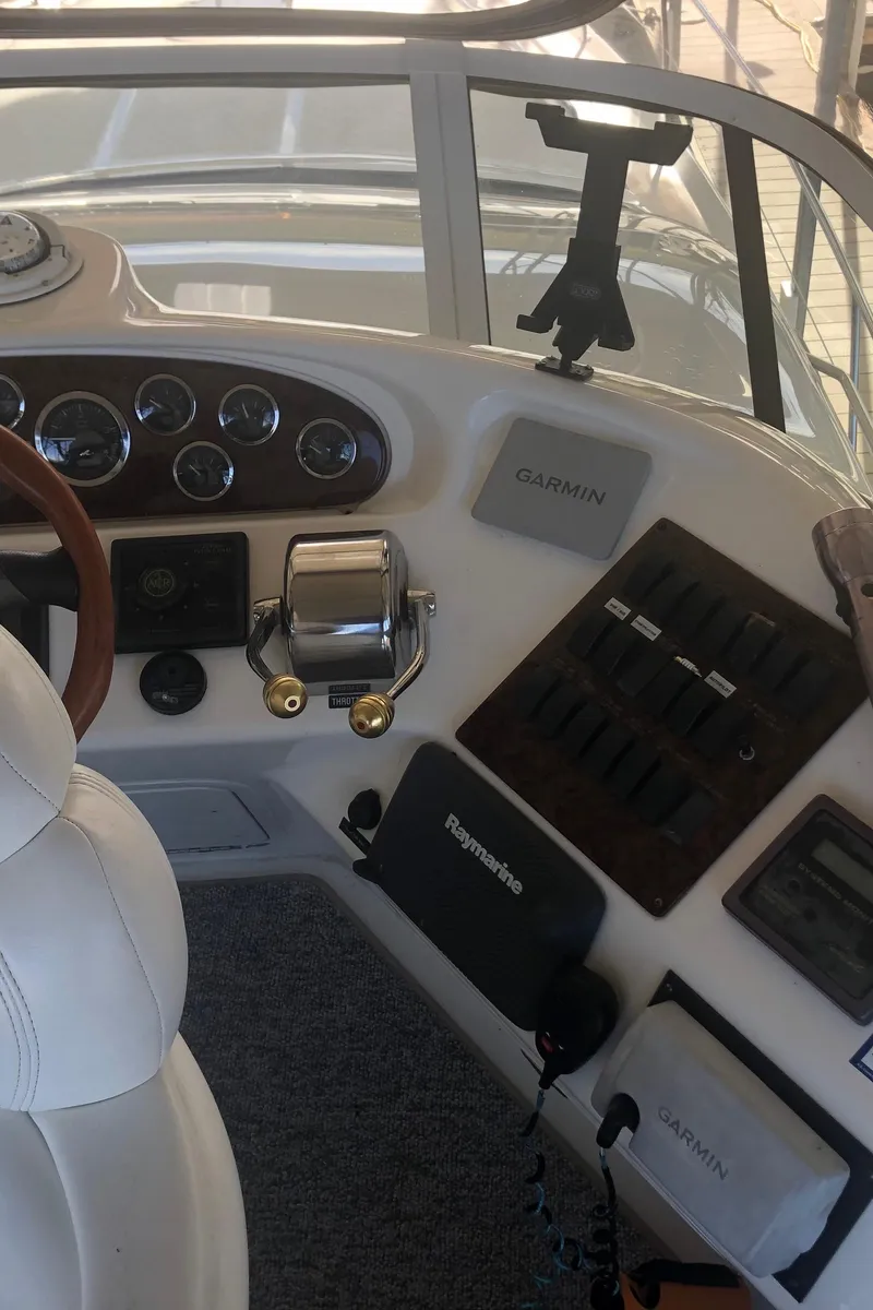 Slide: The Image of 2001 Sea Ray 400 Sedan Bridge helm with Garmin navigation system. - 25