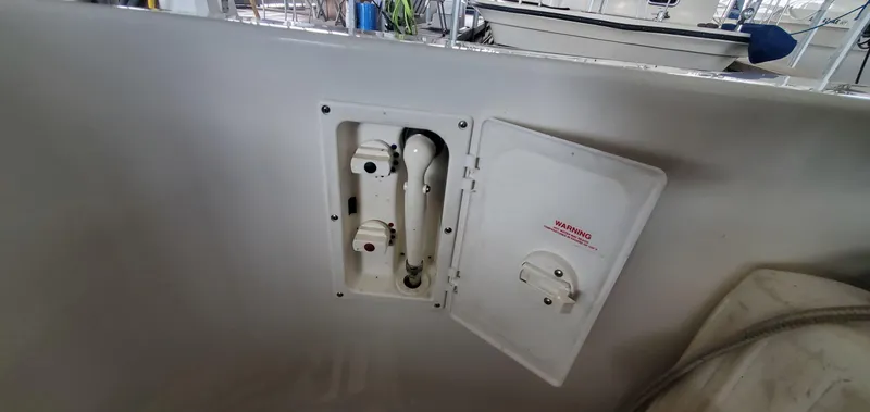 Slide: The Image of 2001 Sea Ray 400 Sedan Bridge boat compartment with open access panel. - 27