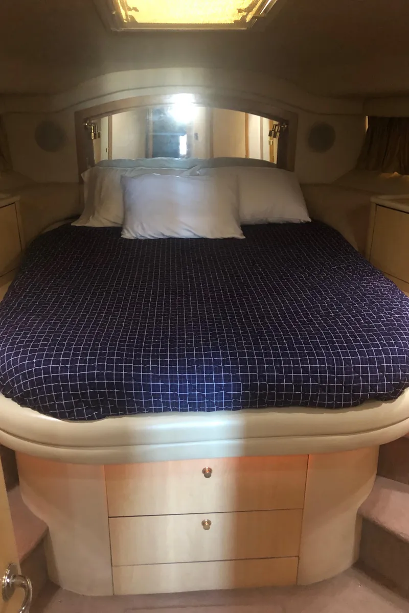 Slide: The Image of Interior cabin of 2001 Sea Ray 400 Sedan Bridge with bed and storage. - 35