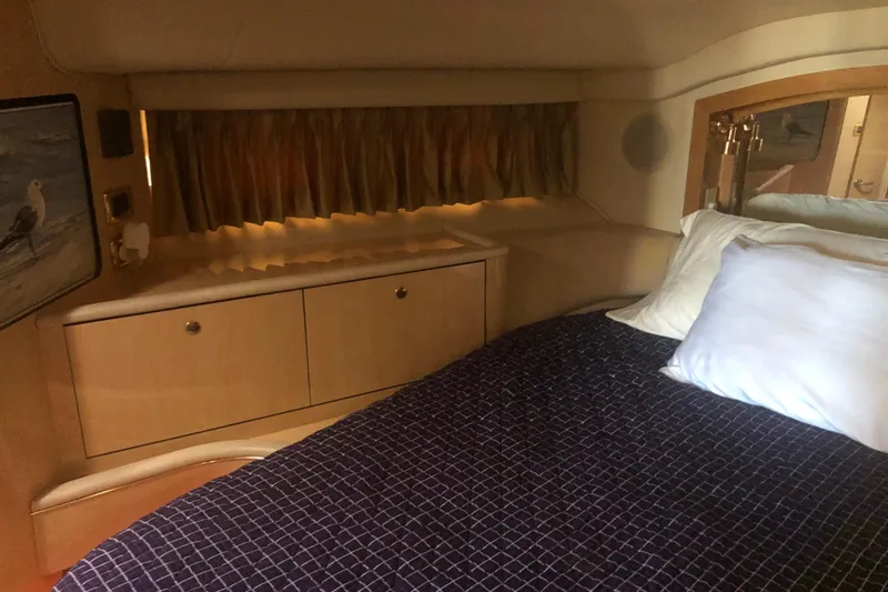 Slide: The Image of Interior cabin of 2001 Sea Ray 400 Sedan Bridge with bed and storage. - 36