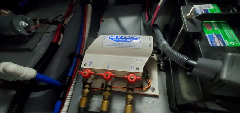 Slide: The Image of Engine compartment of 2001 Sea Ray 400 Sedan Bridge with Reverso oil change system. - 65