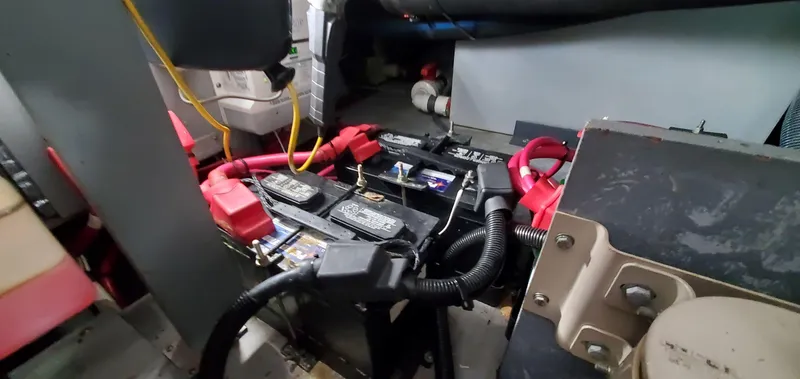 Slide: The Image of Engine room of 2001 Sea Ray 400 Sedan Bridge with visible batteries and wiring. - 67