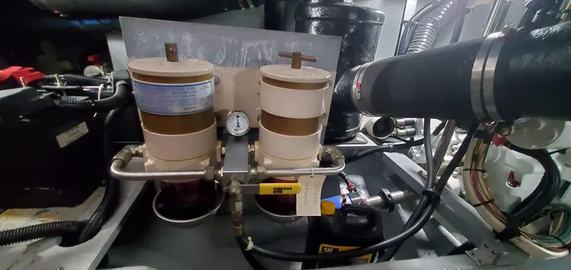 Slide: The Image of Engine room of 2001 Sea Ray 400 Sedan Bridge with dual fuel filters and gauge. - 69