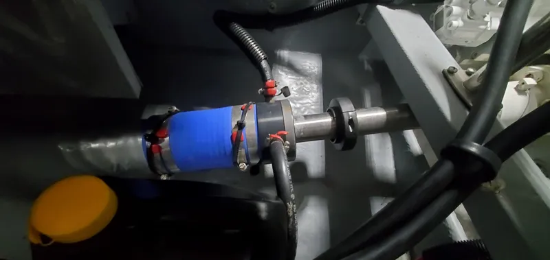 Slide: The Image of Engine room of 2001 Sea Ray 400 Sedan Bridge with visible shaft and components. - 70