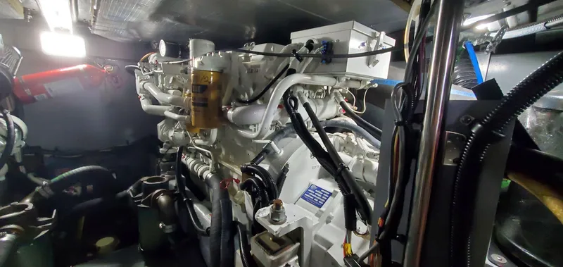 Slide: The Image of Engine room of 2001 Sea Ray 400 Sedan Bridge yacht, showcasing mechanical components. - 72
