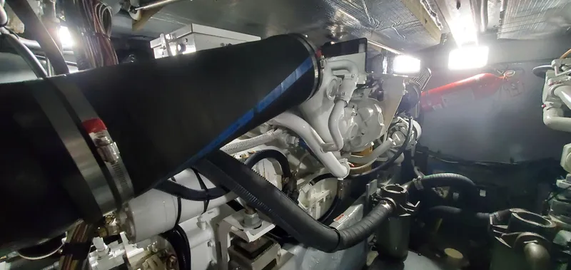 Slide: The Image of Engine room of 2001 Sea Ray 400 Sedan Bridge yacht, showcasing mechanical components. - 73