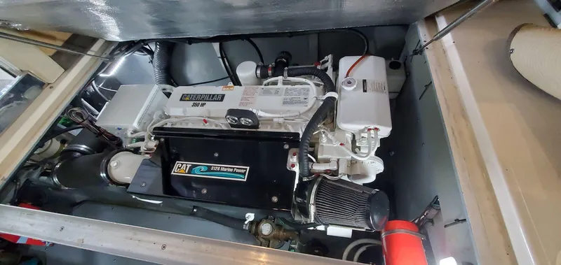 Slide: The Image of Engine compartment of 2001 Sea Ray 400 Sedan Bridge with Caterpillar engine. - 77