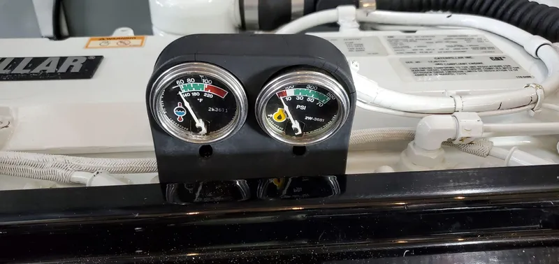Slide: The Image of Engine gauges on a 2001 Sea Ray 400 Sedan Bridge boat. - 82