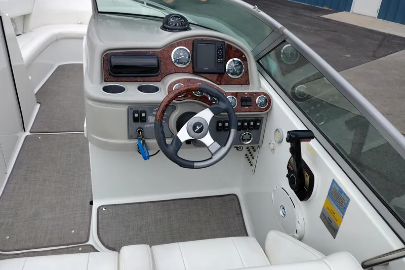 Slide: The Image of 2004 Formula 260 Bowrider dashboard with steering wheel and control panel. - 11