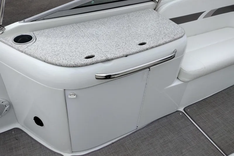 Slide: The Image of 2004 Formula 260 Bowrider interior with granite countertop and white seating. - 14