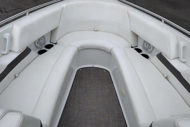 Slide: The Image of 2004 Formula 260 Bowrider interior with white seating and cup holders. - 16