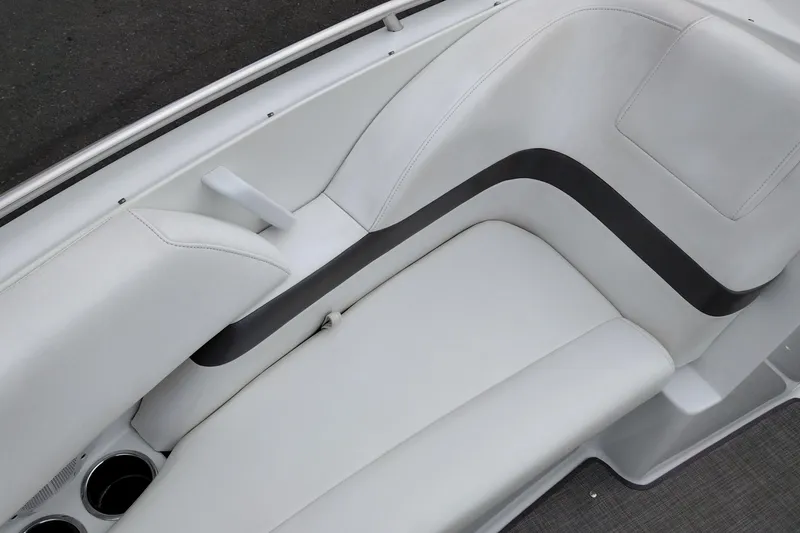 Slide: The Image of 2004 Formula 260 Bowrider interior seating with white upholstery and cup holders. - 17