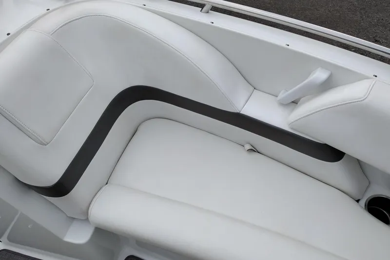 Slide: The Image of 2004 Formula 260 Bowrider boat interior with white leather seating and black accents. - 18