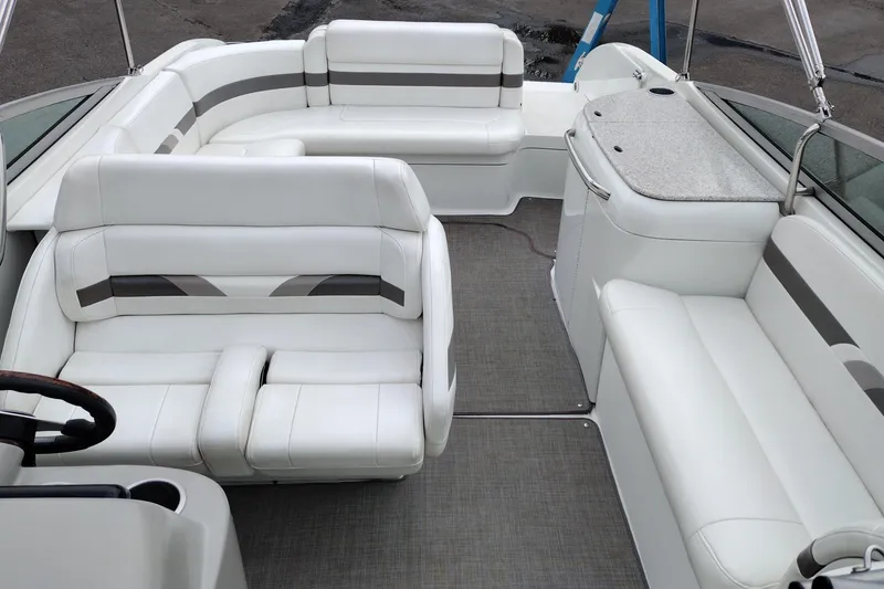 Slide: The Image of 2004 Formula 260 Bowrider interior with white seating and gray accents. - 19