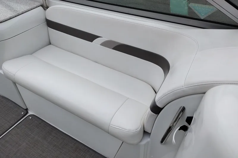 Slide: The Image of 2004 Formula 260 Bowrider interior seating with white and gray upholstery. - 20