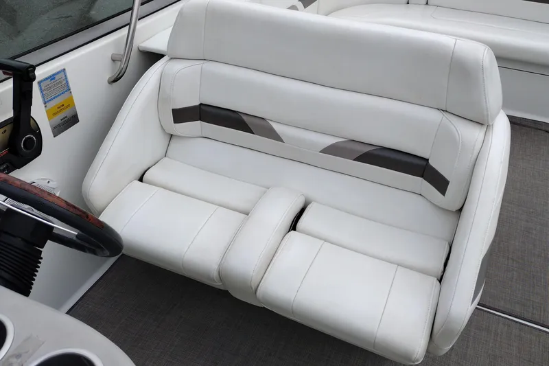 Slide: The Image of 2004 Formula 260 Bowrider interior with white leather seating and steering wheel. - 21