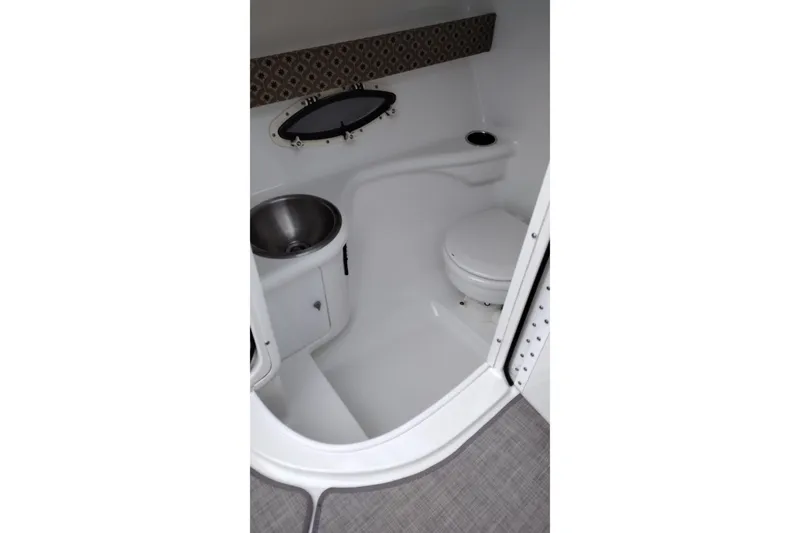 Slide: The Image of 2004 Formula 260 Bowrider boat bathroom with sink and toilet. - 22