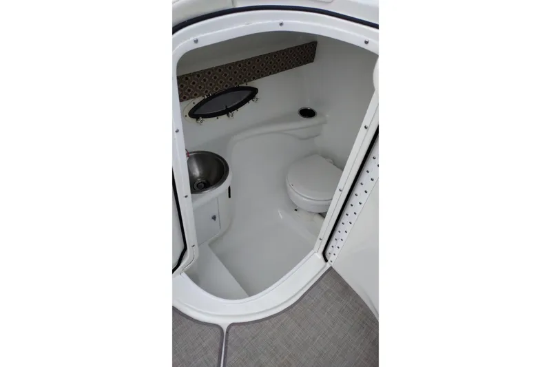 Slide: The Image of Interior of 2004 Formula 260 Bowrider boat bathroom with sink and toilet. - 23