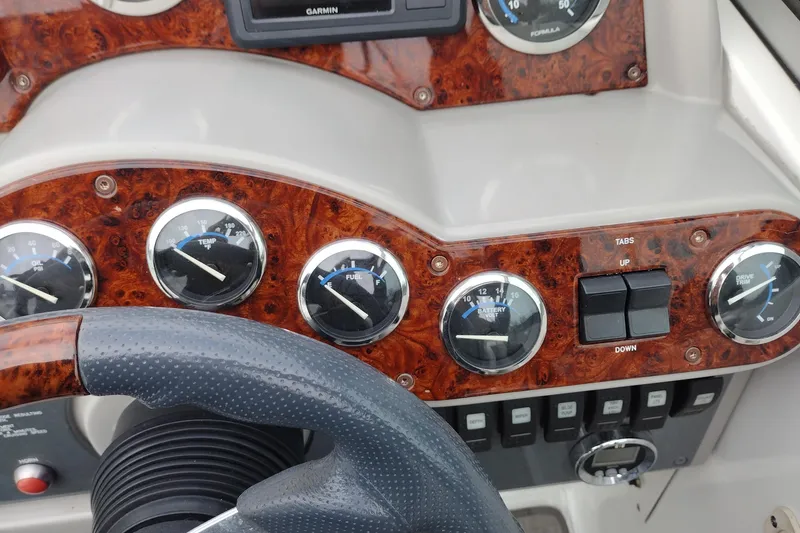Slide: The Image of Dashboard of a 2004 Formula 260 Bowrider boat with gauges and controls. - 28