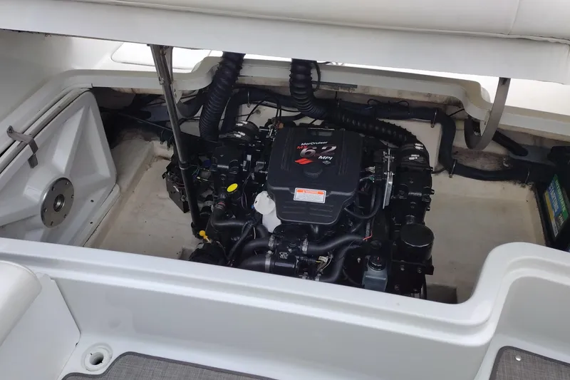 Slide: The Image of Engine compartment of a 2004 Formula 260 Bowrider boat, featuring a MerCruiser engine. - 29
