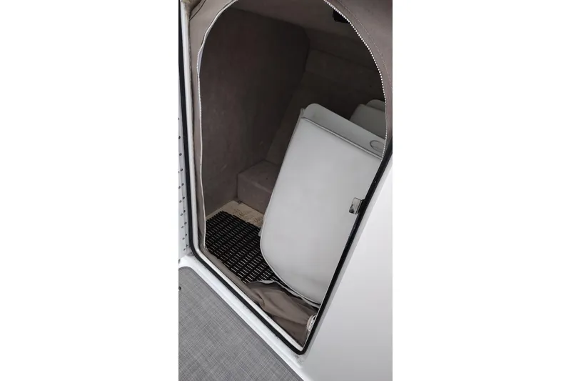 Slide: The Image of 2004 Formula 260 Bowrider interior cabin with seating and storage. - 32