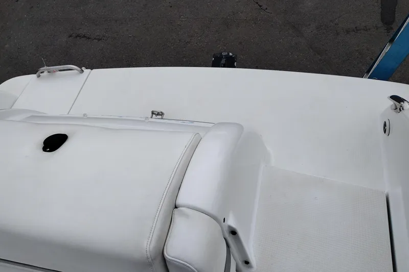 Slide: The Image of 2004 Formula 260 Bowrider boat deck with white upholstery and sleek design. - 33
