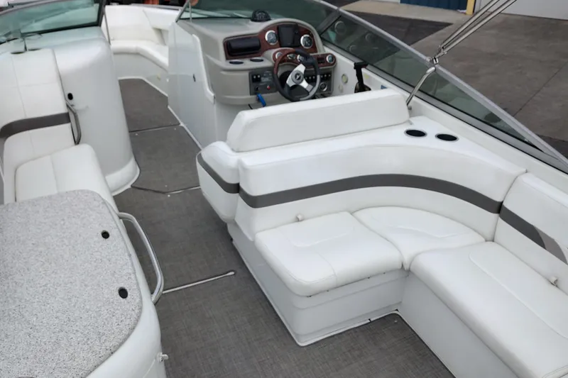 Slide: The Image of 2004 Formula 260 Bowrider interior with white seating and modern dashboard. - 36