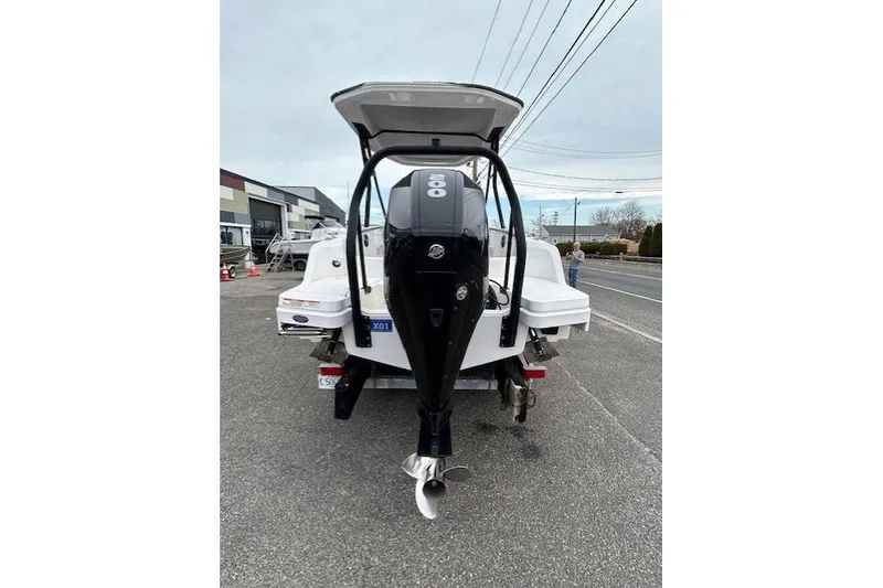 Slide: The Image of 2022 Axopar 22 T-Top boat with outboard motor on a trailer. - 7