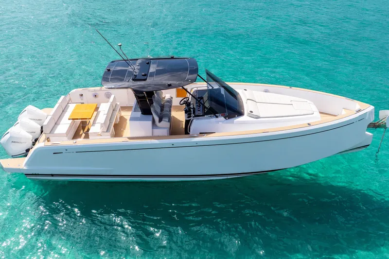 Slide: The Image of 2025 Pardo Yachts P38 luxury boat on clear turquoise water. - 12