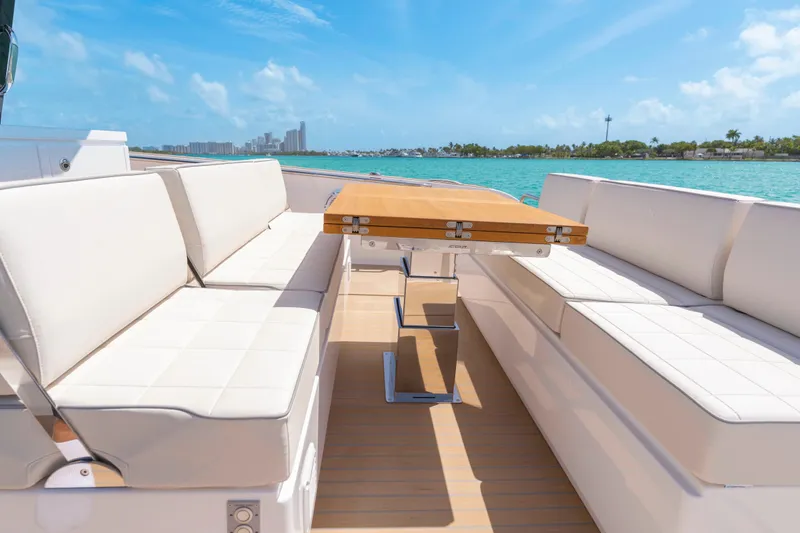 Slide: The Image of Luxurious seating area on 2025 Pardo Yachts P38, with ocean view and clear skies. - 18