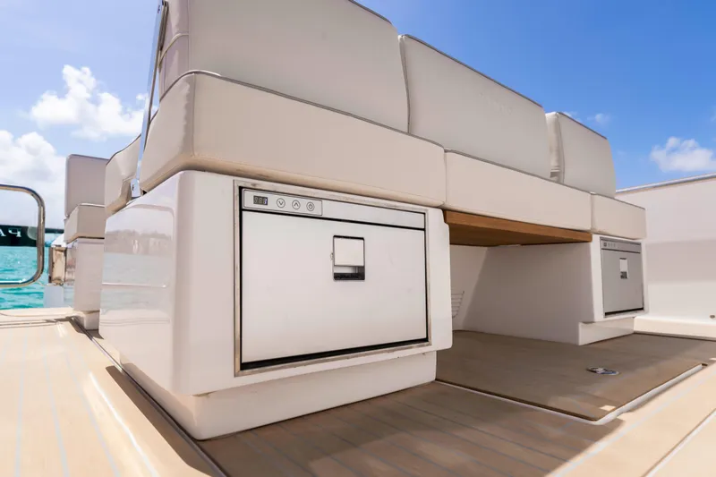 Slide: The Image of Luxury seating area on 2025 Pardo Yachts P38, featuring built-in storage. - 24