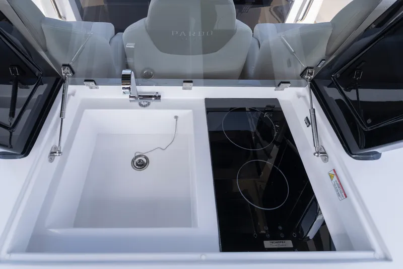Slide: The Image of 2025 Pardo Yachts P38 kitchen area with sink and dual-burner stove. - 27