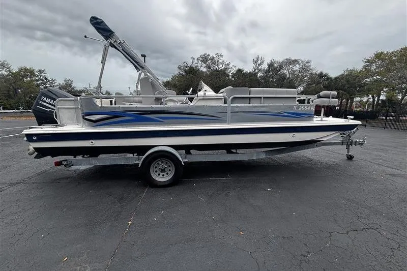 The Image of 2008 Hurricane FunDeck 226 REF-3 Gate boat on trailer, parked outdoors. - 1