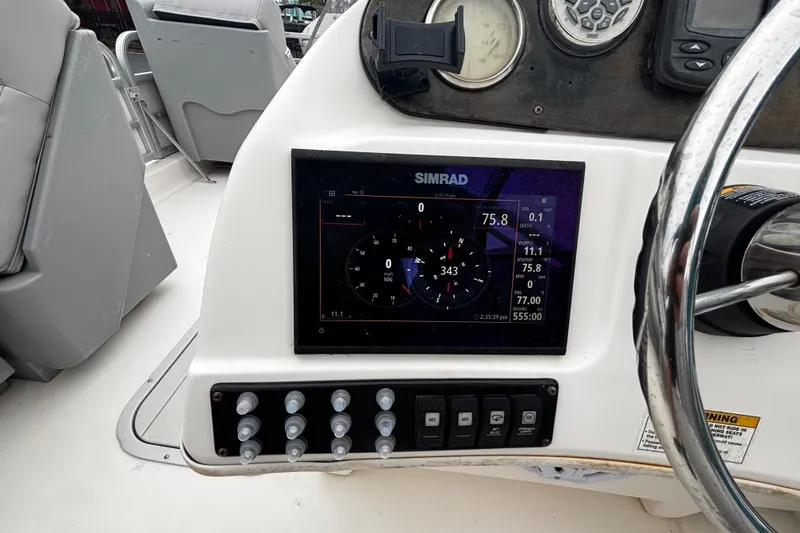 Slide: The Image of Dashboard of 2008 Hurricane FunDeck 226 REF-3 Gate with Simrad navigation display. - 11