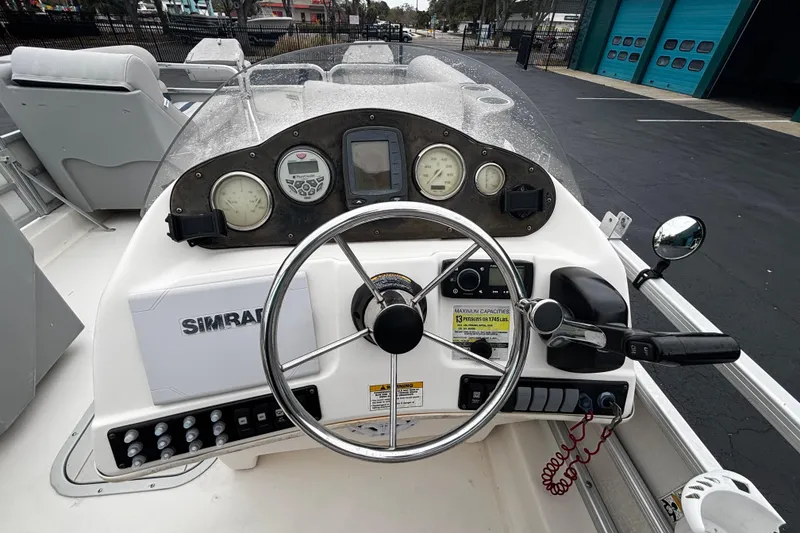 Slide: The Image of 2008 Hurricane FunDeck 226 REF-3 Gate boat dashboard with steering wheel and controls. - 12