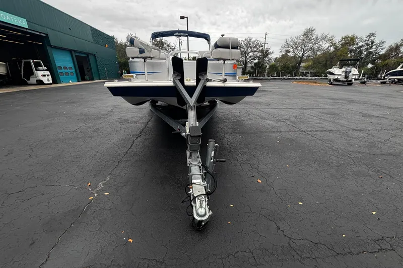 Slide: The Image of 2008 Hurricane FunDeck 226 REF-3 Gate boat on trailer in parking lot. - 4