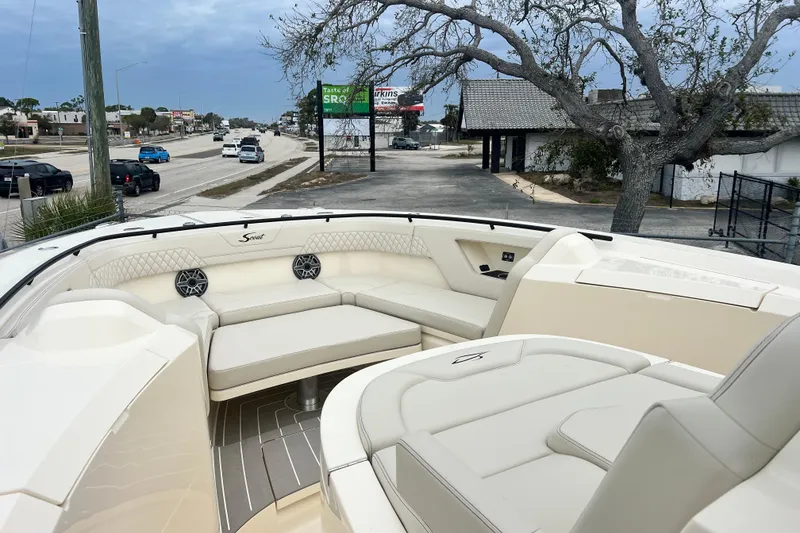 Slide: The Image of Luxurious 2026 Scout 377 LXF boat interior with plush seating and modern design. - 13
